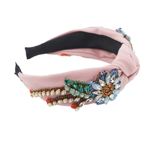 Baroque pink padded headband with colorful crystal flower and vintage knot design
