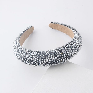 Detail of silver beaded padded headband featuring hand-sewn shimmering crystals
