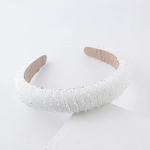 Detailed side view of handcrafted beaded wide headband with crystals and white pearls