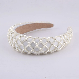 Padded white satin headband with faux pearls in a diamond pattern for weddings