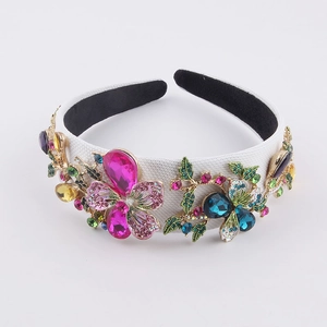 Baroque floral headband with colorful crystals and metal petals on white fabric