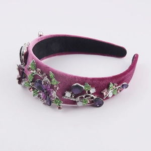 Detail of baroque velvet headband featuring purple rhinestones and floral crystal pattern