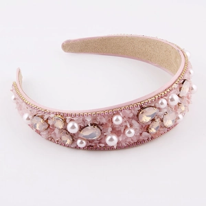 Detail of baroque headband featuring pink crystals, champagne gems and white pearls