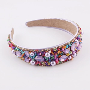 Detail of baroque headband with purple crystals, faux pearls and gold rhinestone trim