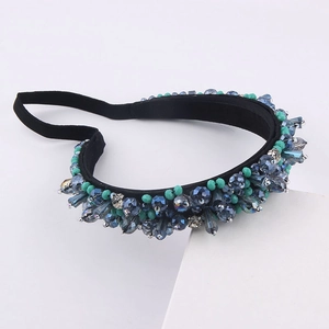 Baroque style headband featuring deep blue and emerald crystals with handmade beadwork