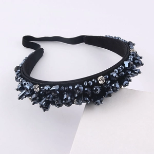 Detail of luxury padded headband featuring deep blue crystal beads and sparkling rhinestones