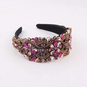Close-up of luxury Baroque headband featuring purple and magenta crystal floral patterns