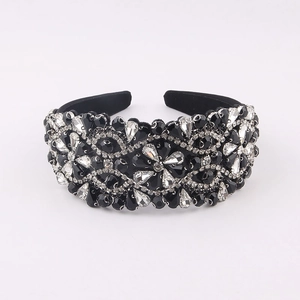 Detail of baroque headband with hand-set black and clear crystals in floral patterns