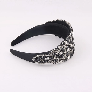Detailed macro view of baroque headband featuring black crystals and rhinestones