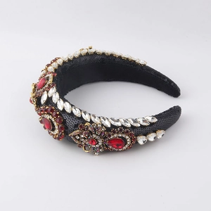 Detailed view of Baroque headband with red crystals and sequins on thick sponge base
