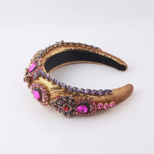 Baroque padded headband with gold sequins, pink rhinestones, and metal flower details