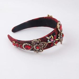 Serre-tête large de style baroque avec strass rouges et fleurs dorées antiques