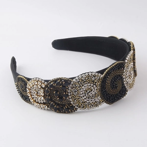 Baroque padded headband with intricate beads and rhinestones in ornate swirl patterns