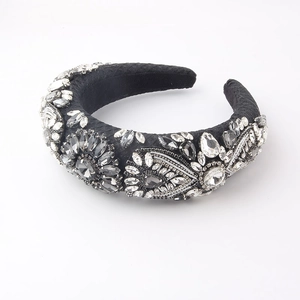 Detailed view of Baroque padded headband with intricate floral crystals and geometric rhinestones