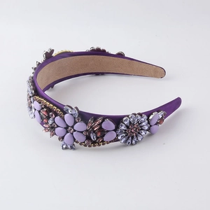 Detail of purple baroque headband featuring crystal floral patterns and velvet texture