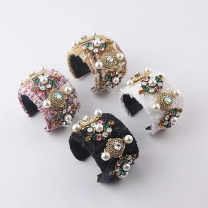 Set of four tweed bangles with faux pearls and crystals in black white pink and yellow
