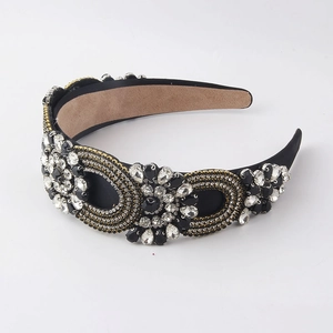 Detailed view of baroque headband featuring black crystals and golden bead embroidery