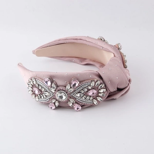 Pink baroque knotted headband with luxurious rhinestones and premium silk fabric finish