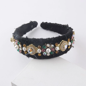 Detailed view of luxury black tweed headband with colorful rhinestones and pearls