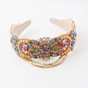Detailed macro view of the luxury padded headband with colorful rhinestones and gold tassels