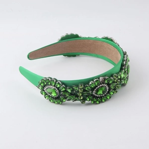 Elegant emerald green velvet headband featuring sparkling rhinestone floral patterns