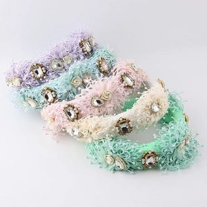 Detail of baroque lace headbands with sparkling rhinestones in assorted pastel colors