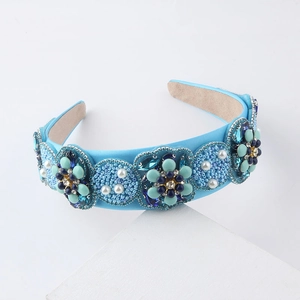 Detailed view of sky blue baroque headband with intricate beads and faux pearls