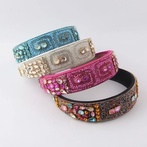 Close-up of four baroque hand-beaded headbands with sparkling rhinestones and seeds