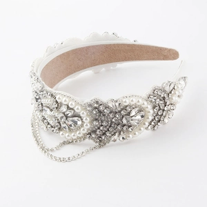 Close-up of floral pearl headband with hanging rhinestone tassels and velvet lining