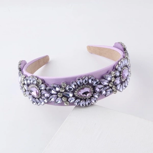 Elegant purple velvet headband with sparkling crystal rhinestones in a floral cluster design