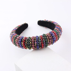 Baroque padded headband with colorful rhinestones in vertical stripe pattern on white block