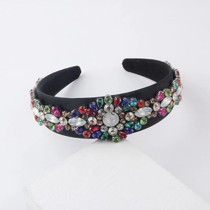 Close-up of Baroque headband with colorful rhinestones on black velvet padding