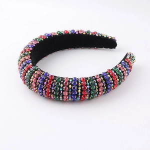 Padded velvet headband featuring colorful rhinestones in a baroque luxury style