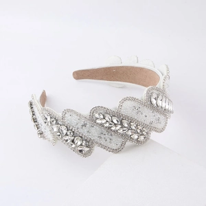 Detailed view of Baroque wide headband featuring white fabric with sparkling crystals