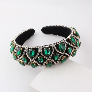 Macro detail of baroque sponge headband with emerald green crystals and silver rhinestones
