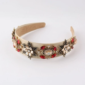 Close-up of Baroque style headband with colorful rhinestones and vintage metal details