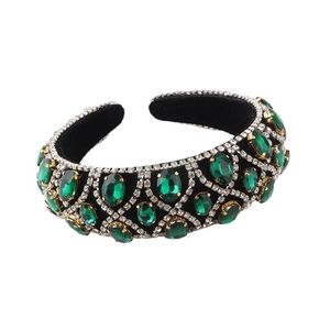 Baroque padded headband with green emeralds and white rhinestones on black velvet