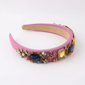 Detail of pink baroque padded headband with colorful rhinestones, pearls and butterflies
