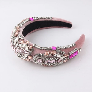 Detail of pink velvet headband with rows of shimmering pink rhinestones in baroque style