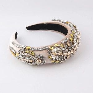 Detailed view of champagne satin headband with hand-sewn crystals and luxury rhinestones