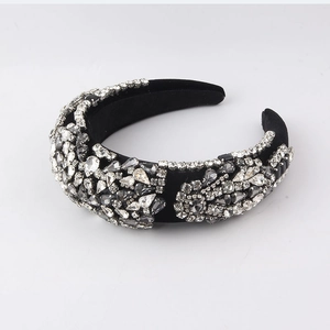 Close-up of luxury sponge headband with grey rhinestones and velvet texture
