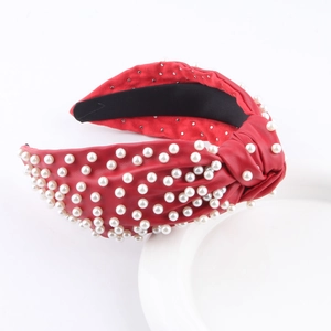 Fashionable red faux leather knotted headband with elegant white pearls for women