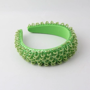 Bright green padded headband featuring handmade beads and sequins in retro style