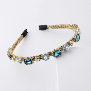 Elegant woven gold headband with blue gemstones and floral pearl embellishments
