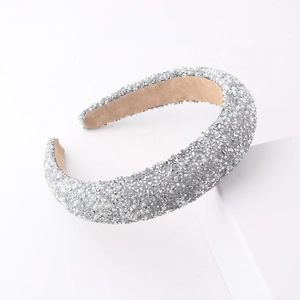 Close-up of wide padded headband with luxury silver rhinestones and white pearls details