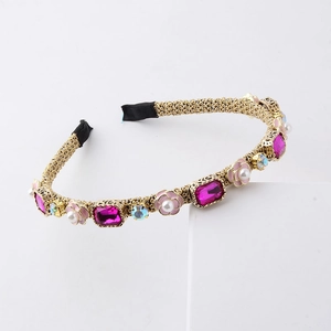 Detail of woven gold headband with pink crystals, enamel flowers, and faux pearls