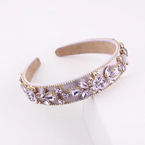 Elegant purple baroque headband with rhinestones and gold floral accents on white background