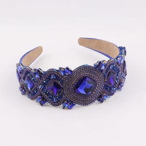 Detail view of Baroque wide headband with blue crystals and intricate beadwork on a soft lining