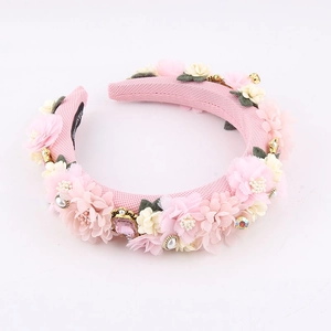 Pink baroque floral headband with pearls, rhinestones and gemstones on white background