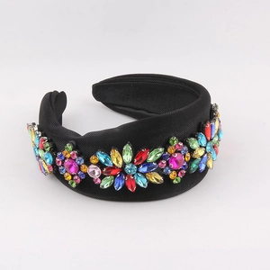 Detail of a padded black headband with colorful rhinestones in floral patterns